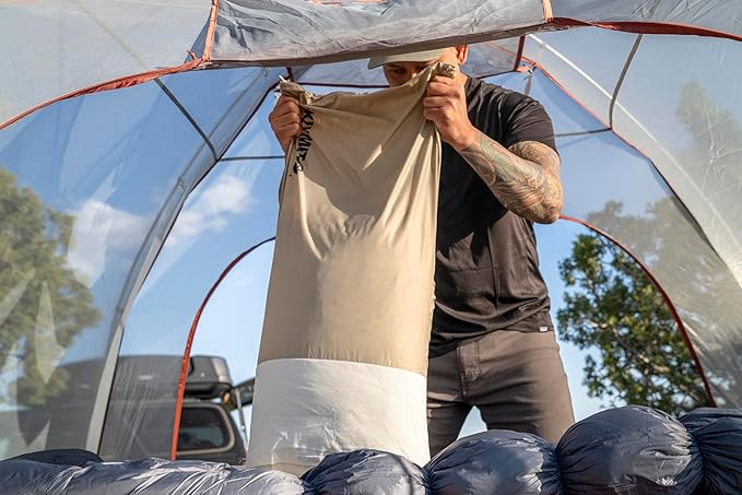 KLYMIT Drift Camping Pillow | Lightweight, Travel Head Rest for Sleep Filled with Shredded Memory Foam, Reversible Outer Cover for Extended Use, Regular Size — Tan